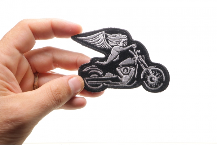 White Biker Angel On Motorcycle Patch shown on hand for size comparison