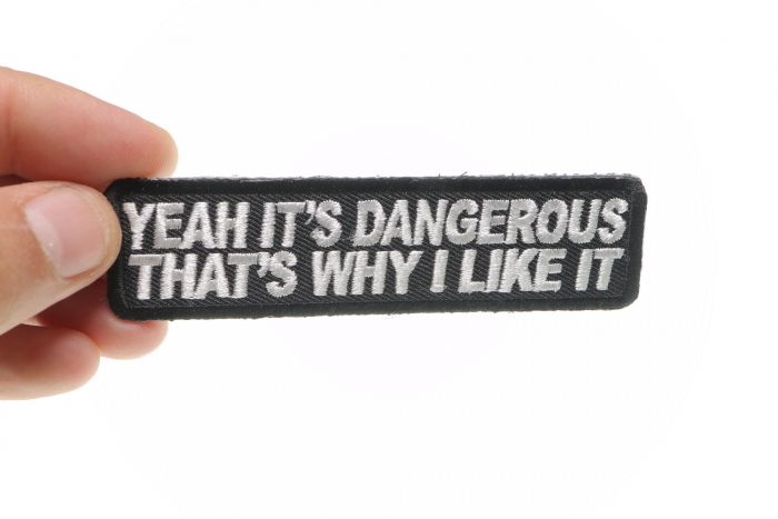 Yeah It's Dangerous Thats Why I Like It Patch, Biker Saying Patches shown on hand for size comparison