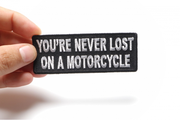 You're Never Lost On A Motorcycle Patch, Biker Saying Patches shown on hand for size comparison