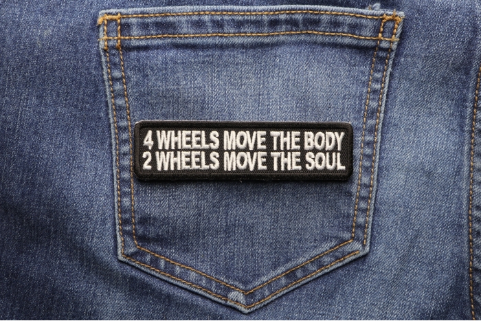 4 Wheels Move The Body 2 Wheels Move The Soul Patch shown on jeans