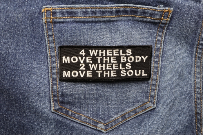 4 Wheels Move The Body 2 Wheels Move The Soul Patch shown on jeans