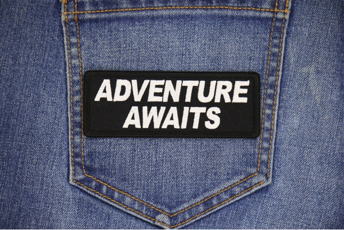 Adventure Awaits Patch shown on jeans