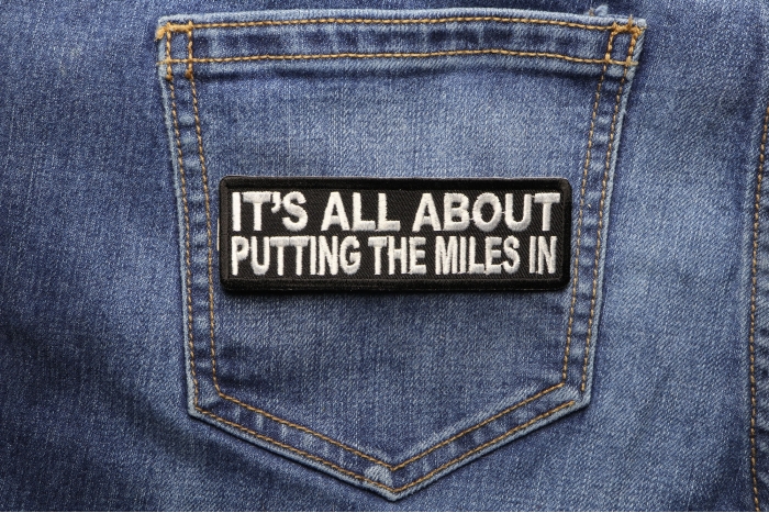 It's All About Putting The Miles In Patch shown on jeans