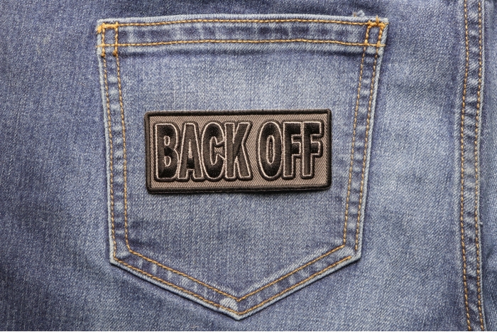 BACK OFF Patch shown on jeans