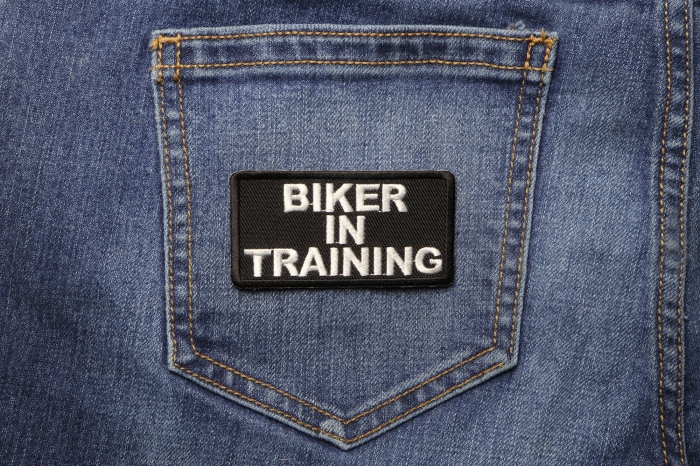 Biker In Training Patch shown on jeans