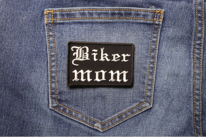 Biker Mom Patch In Old English shown on jeans