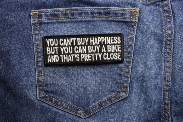 You Can't Buy Happiness But You Can Buy A Bike and That's Close Patch shown on jeans