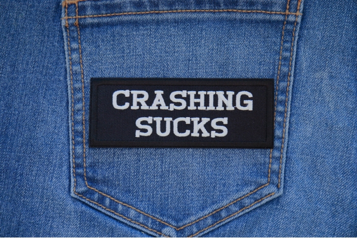 Crashing Sucks Patch shown on jeans