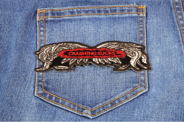 Crashing Sucks Patch Small Wings shown on jeans