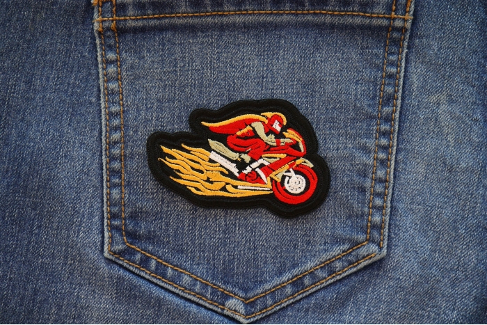 Red Cape Biker on Motorcycle Patch shown on jeans
