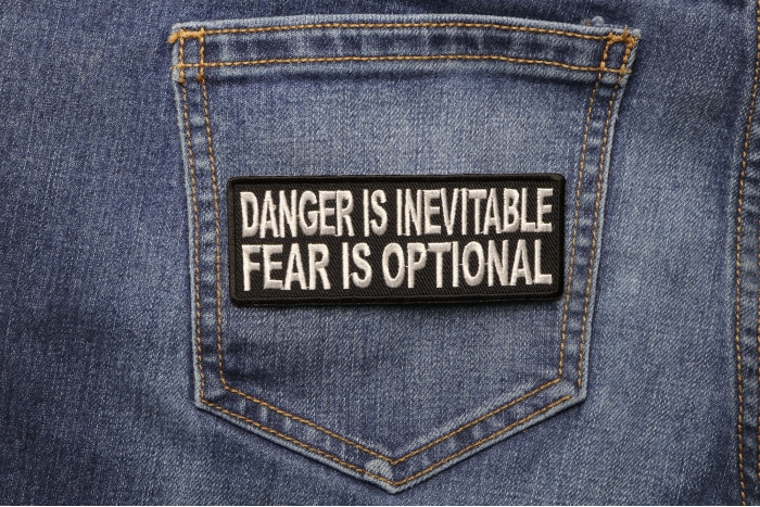 Danger Is Inevitable Fear Is Optional Patch shown on jeans