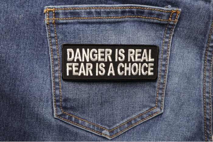 Danger Is Real Fear Is A Choice Patch shown on jeans