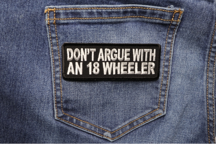 Do Not Argue With An 18 Wheeler Biker Saying Patch shown on jeans