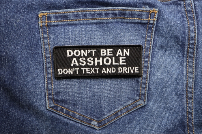 Don't Be An Asshole Don't Text and Drive Patch shown on jeans