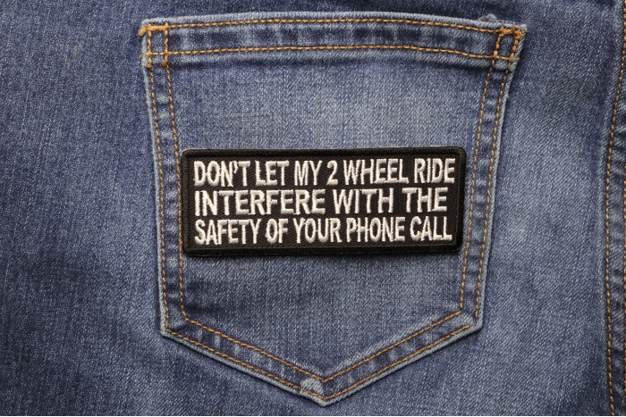 Don't Let My 2 Wheel Ride Interfere With The Safety Of Your Phone Call Patch shown on jeans