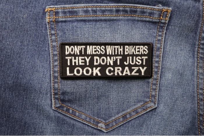 Don't Mess With Bikers They Don't Just Look Crazy Patch shown on jeans