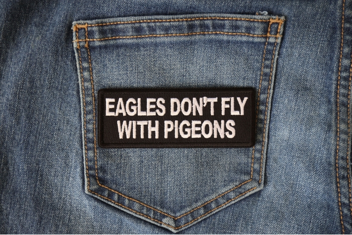 Eagles Don't Fly with Pigeons Patch shown on jeans