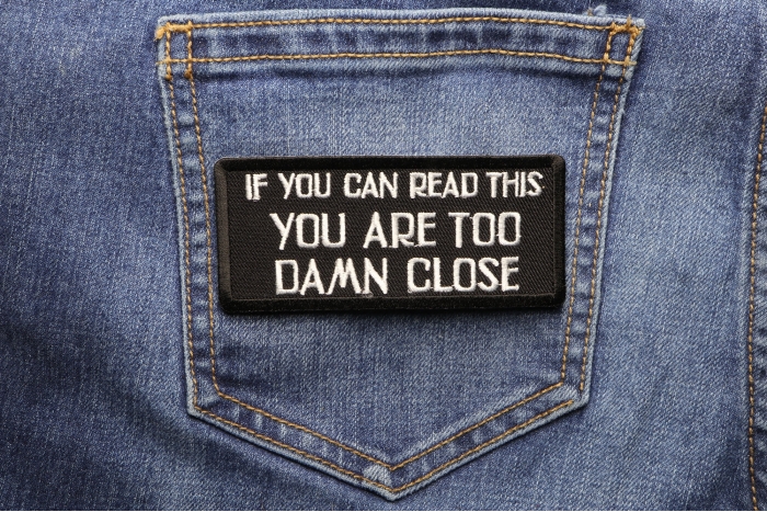If You Can Read This You Are Too Damn Close Patch shown on jeans
