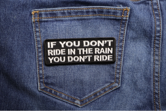 If You Don't Ride In The Rain You Don't Ride Patch shown on jeans