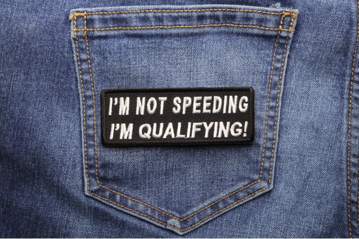 I'm Not Speeding I'm Qualifying Patch shown on jeans