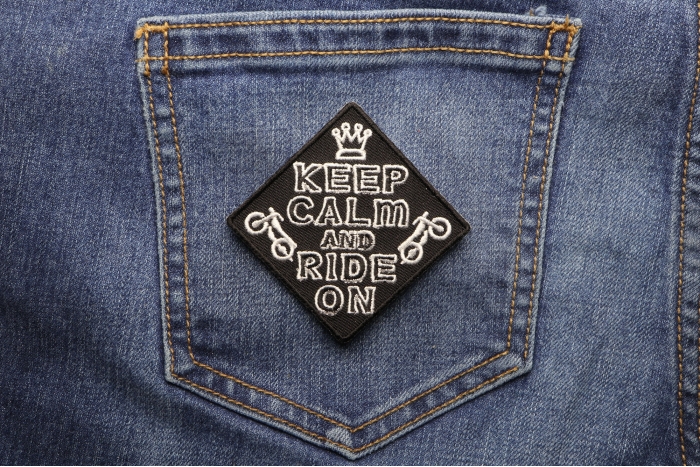 Keep Calm and Ride On Patch shown on jeans