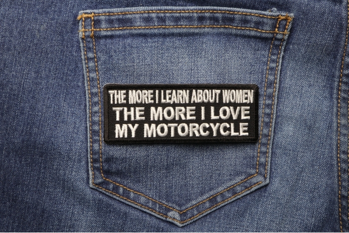 The more I Learn About Women The more I Love My Motorcycle Patch shown on jeans