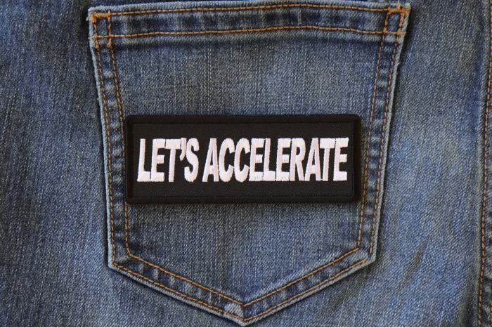 Let's Accelerate Patch shown on jeans