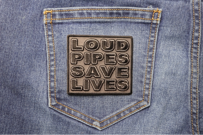 Loud Pipes Save Lives Patch shown on jeans