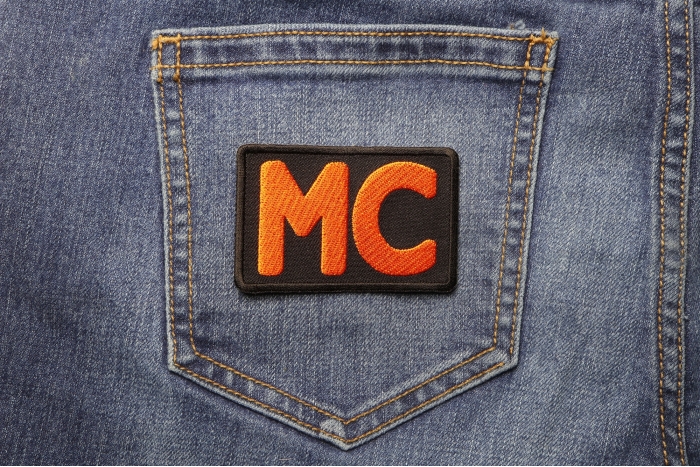 Orange MC Patch shown on jeans