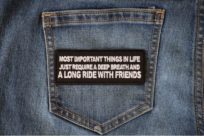 Most Important Things in Life Just Require a Deep Breath and a Long Ride with Friends Patch shown on jeans