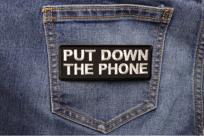 Put Down The Phone Patch shown on jeans