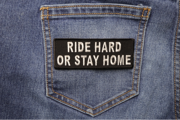Ride Hard or Stay Home Patch shown on jeans