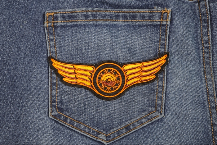 Orange Wings Motorcycle Patch shown on jeans