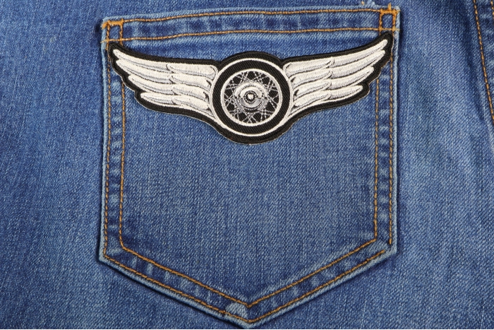Winged Wheel Small Iron on Biker Patch shown on jeans