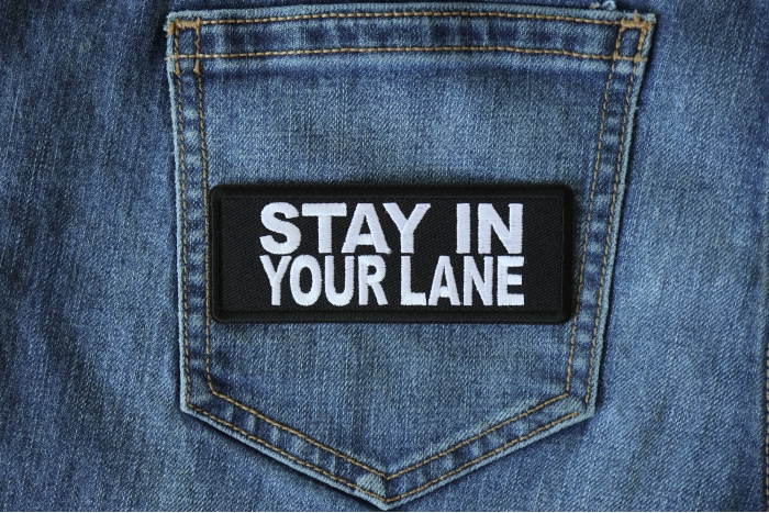 Stay in Your Lane Patch shown on jeans