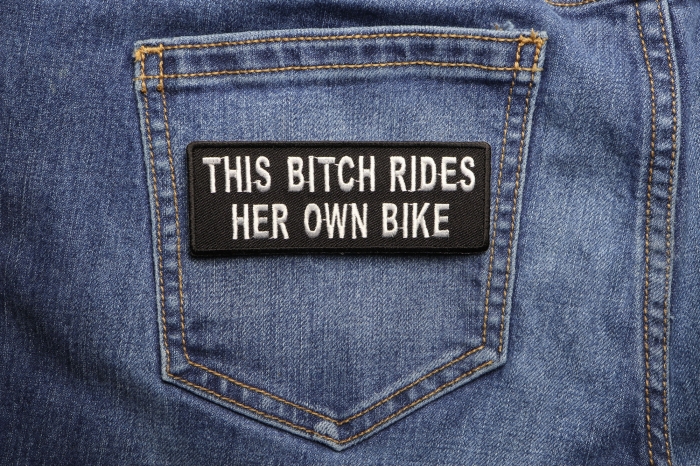 This Bitch Rides Her Own Bike Patch shown on jeans
