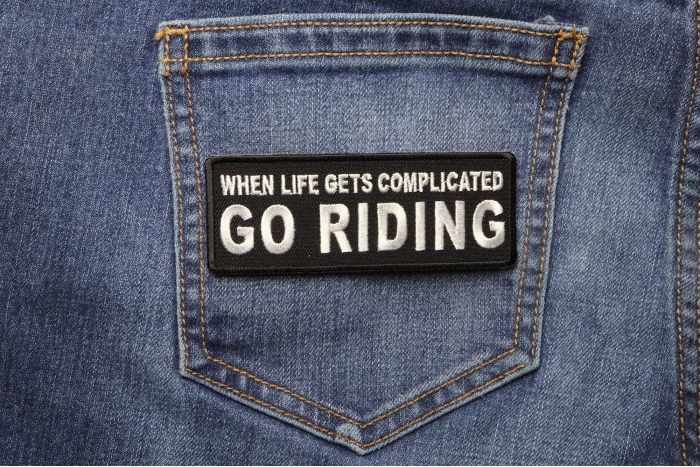 When Life Gets Complicated GO RIDING Patch shown on jeans