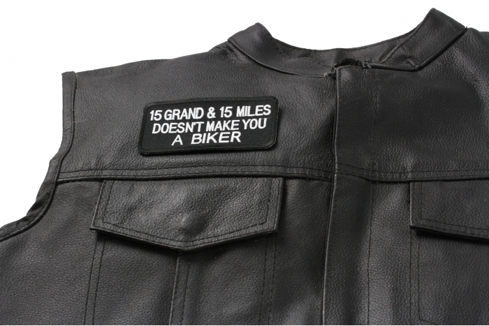 15 Grand 15 Miles Doesn't Make You A Biker Patch, Biker Saying Patches shown on leather vest