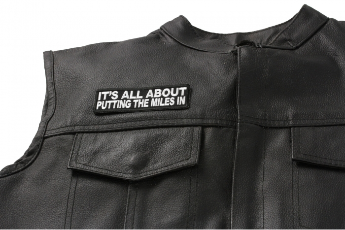 It's All About Putting The Miles In Patch, Biker Saying Patches shown on leather vest