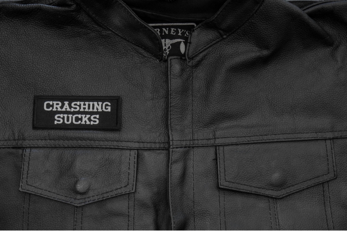 Crashing Sucks Patch, Biker Saying Patches shown on leather vest