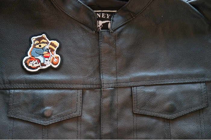 Cute Raccoon Biker on Motorcycle Patch, Cute Animal Patches shown on leather vest