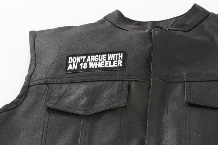 Do Not Argue With An 18 Wheeler Patch - Iron on Patch - 4x1.5 inch shown on leather vest