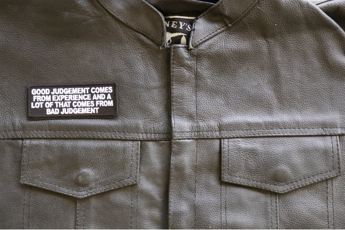 Good Judgement Comes from experience and a lot of that comes from Bad Judgement Patch, Biker Saying Patches shown on leather vest