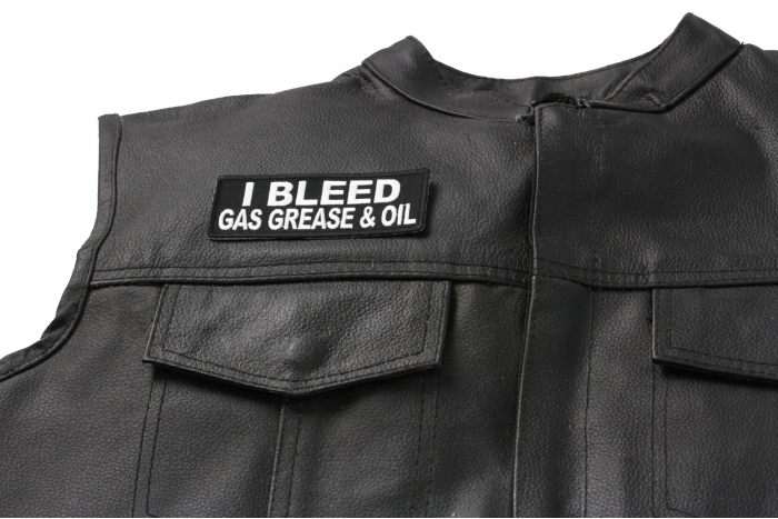 I Bleed Gas Grease and Oil Patch - 4x1.5 inch. Embroidered Iron on Patch shown on leather vest