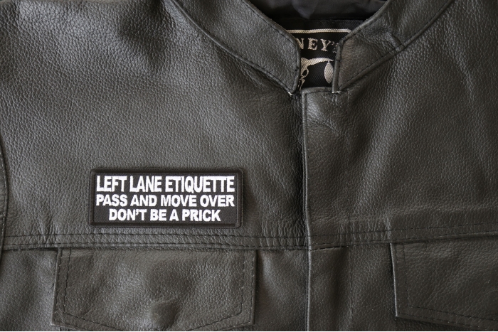 Left Lane Etiquette Pass and move over don't be a prick Patch, Biker Saying Patches shown on leather vest