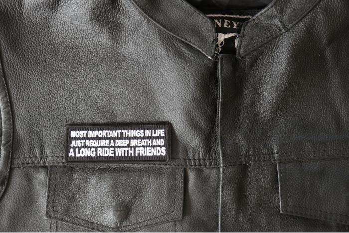 Most Important Things in Life Just Require a Deep Breath and a Long Ride with Friends Patch, Biker Saying Patches shown on leather vest
