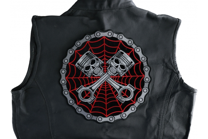 Piston Web Skulls Large Back Patch shown on leather vest
