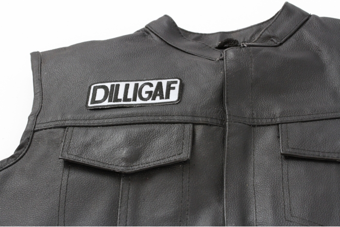 Reflective Dilligaf Patch, Biker Saying Patches shown on leather vest