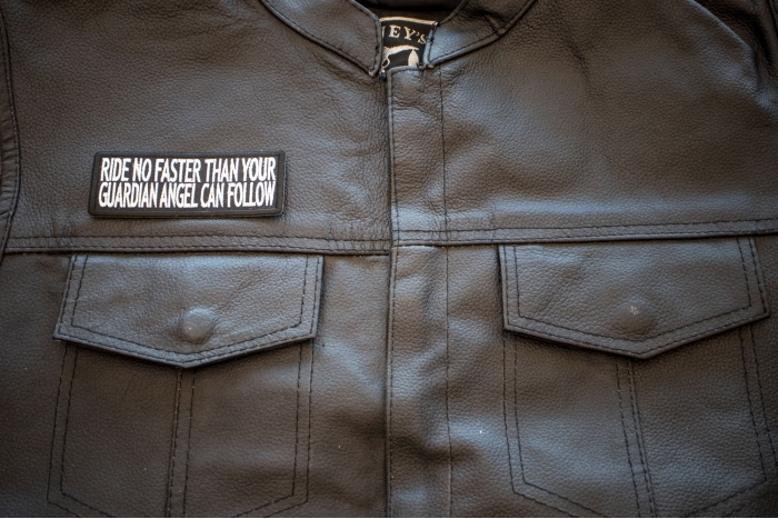 Ride No Faster Than Your Guardian Angel Can Follow Patch, Biker Saying Patches shown on leather vest