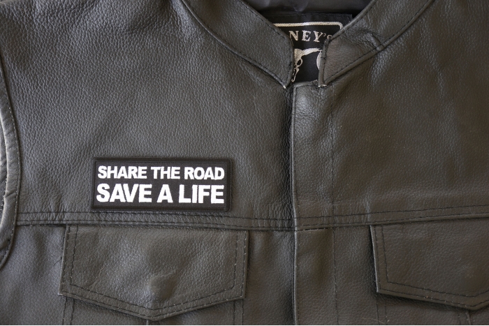 Share The Road Save a Life Patch, Biker Saying Patches shown on leather vest